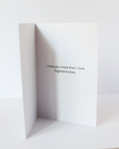 Loving highland cow greeting card